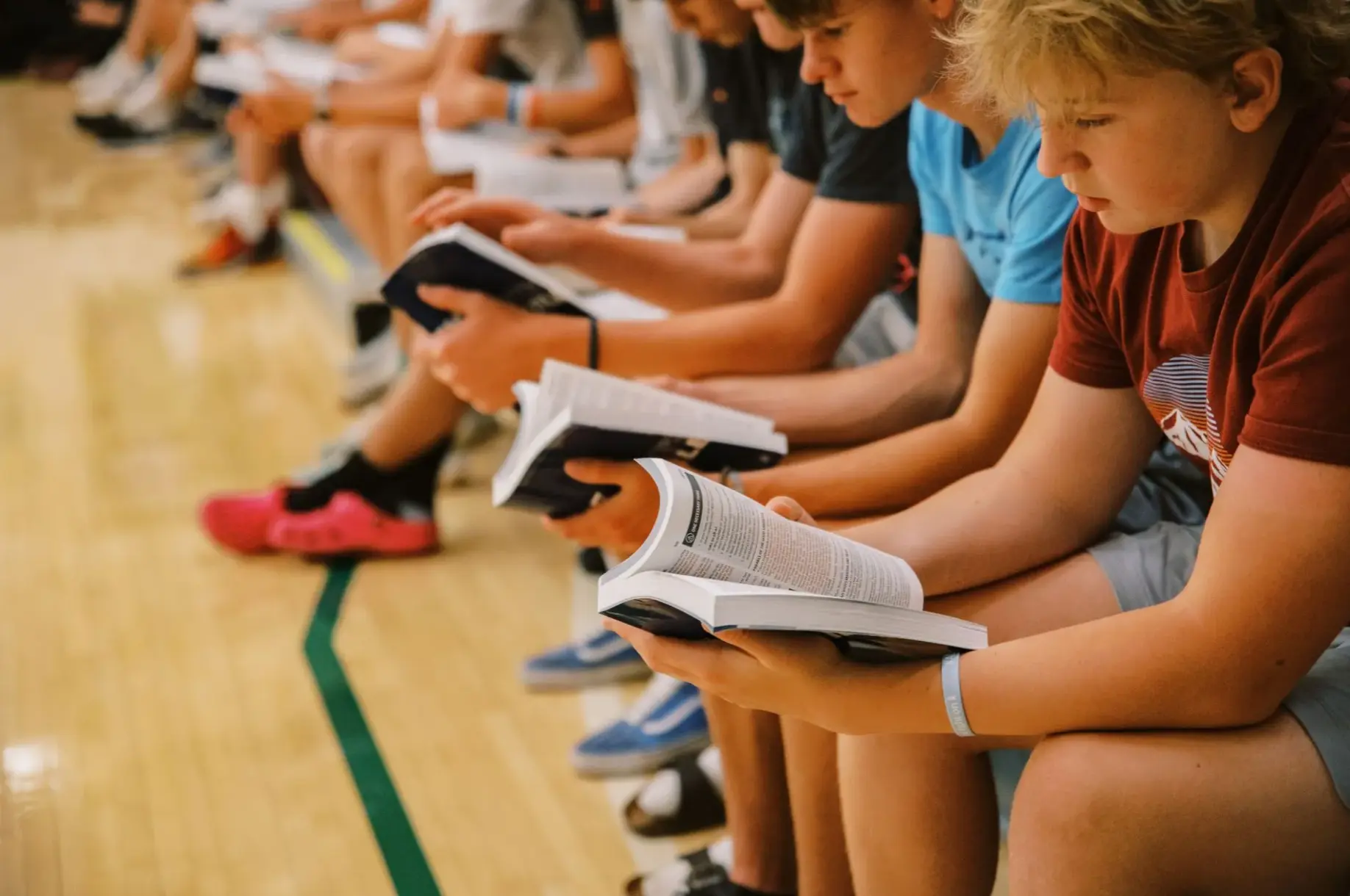 Athletes reading Bibles together